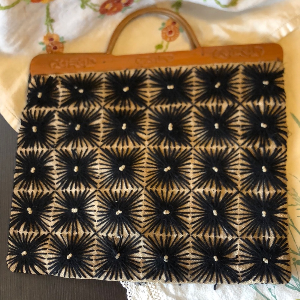Vintage handmade handbag with carved wooden handles